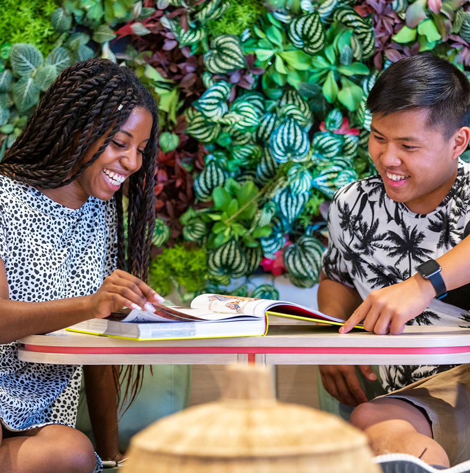 Two friends studying outside