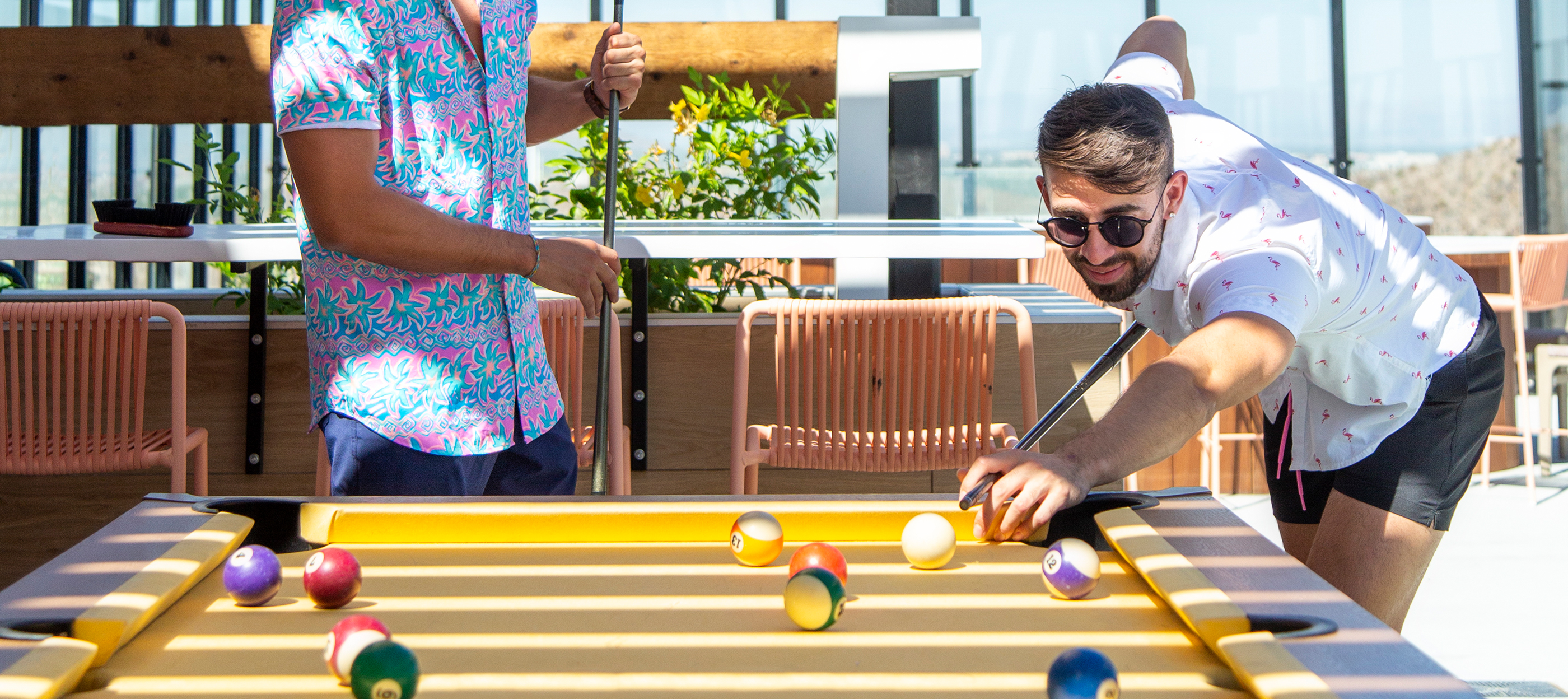 Two people playing pool