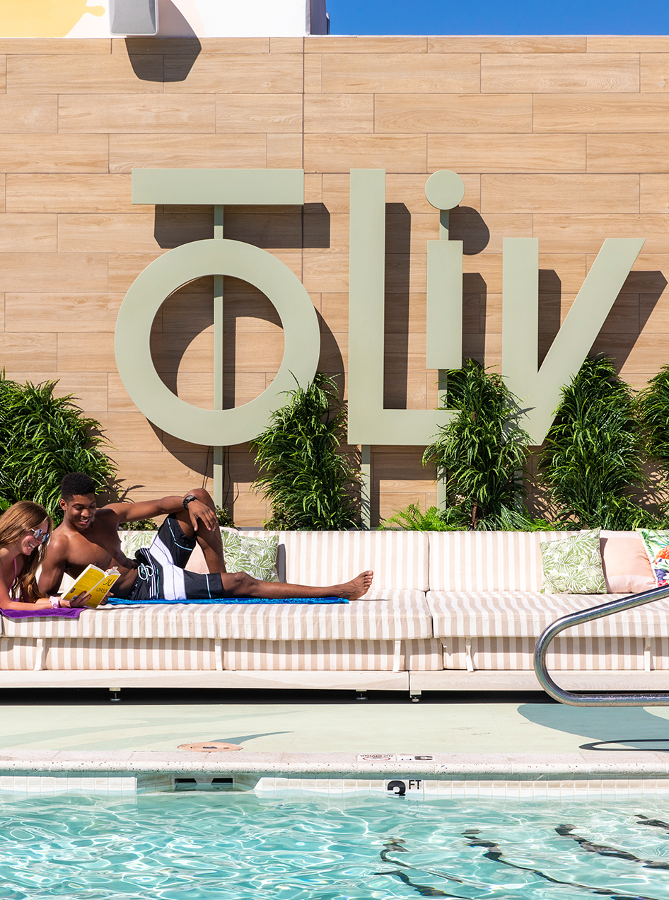 Young couple relaxing by the pool