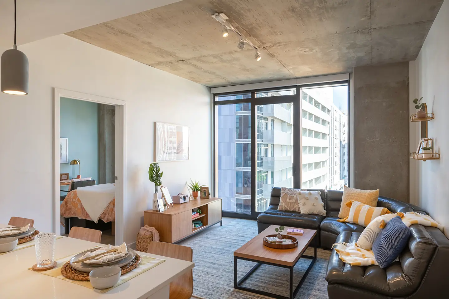apartment interior at ōLiv Tempe, fitted with couch, TV stand, and coffee table